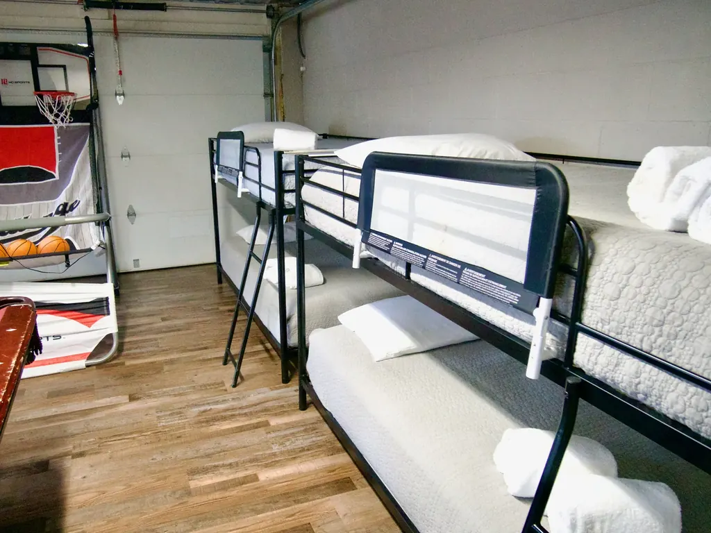 Two sets of bunk beds in the cabin's downstairs game room