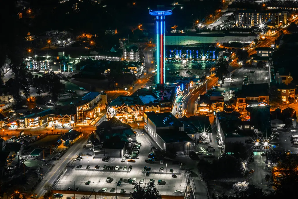 Downtown Gatlinburg lit up at night, with the Space Needle in the center