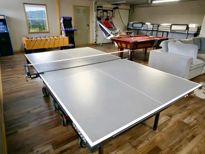 Game room with ping pong, a pool table, foosball and arcade games