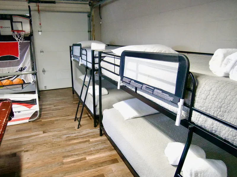 Two sets of bunk beds in the cabin's downstairs game room