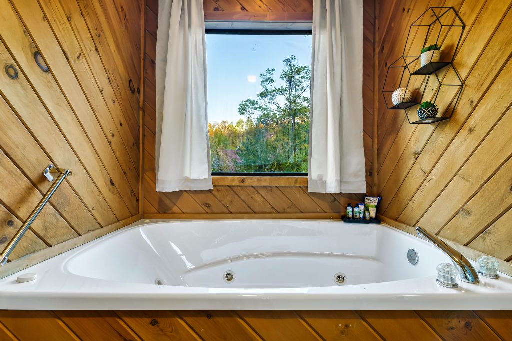 Jacuzzi off the 2nd king bedroom at Smoky Mountains Lodge cabin in Wears Valley, TN