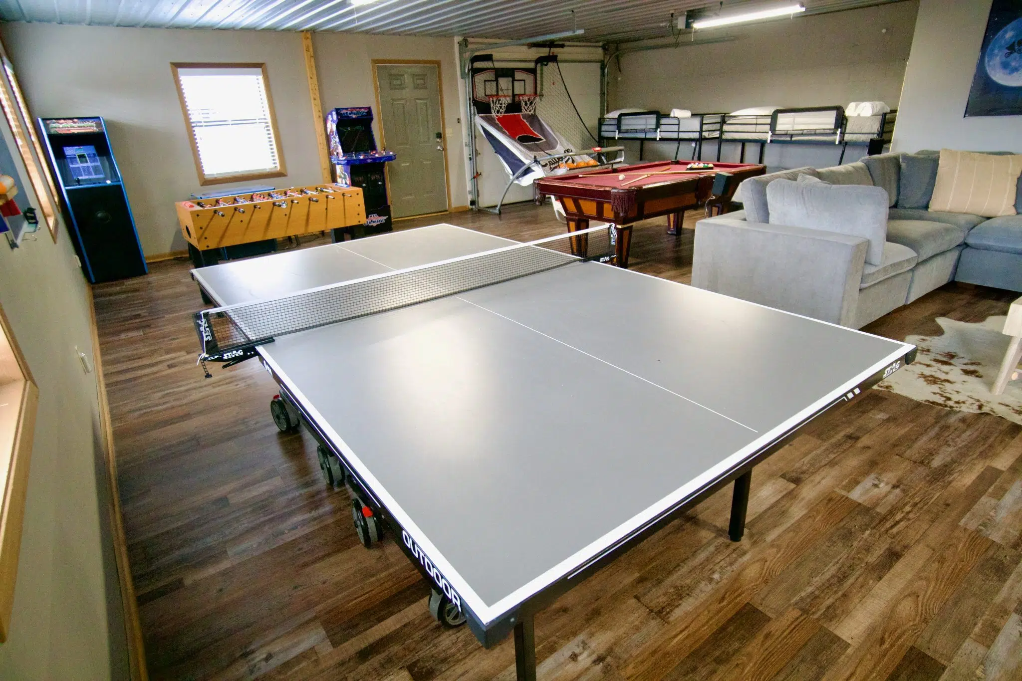 Wide shot of the 900 sq ft game room at Smoky Mountains Lodge family cabin near Gatlinburg